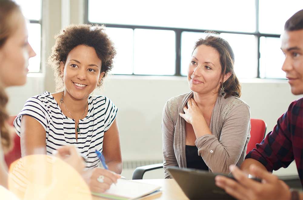 Group of people listening in meeting