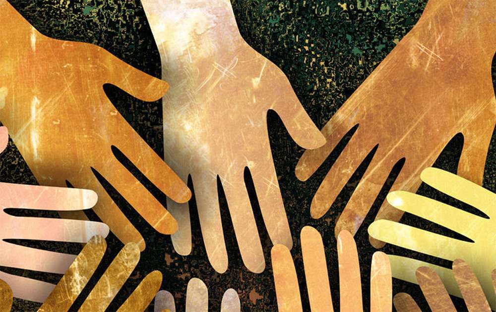 Cut out of hands with different skin colour