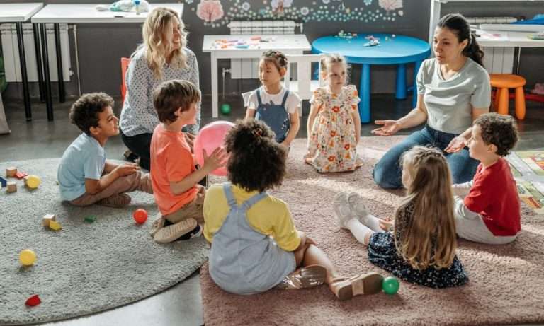 teachers with children in a group