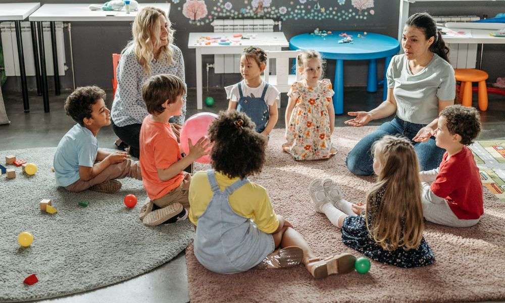 teachers with children in a group