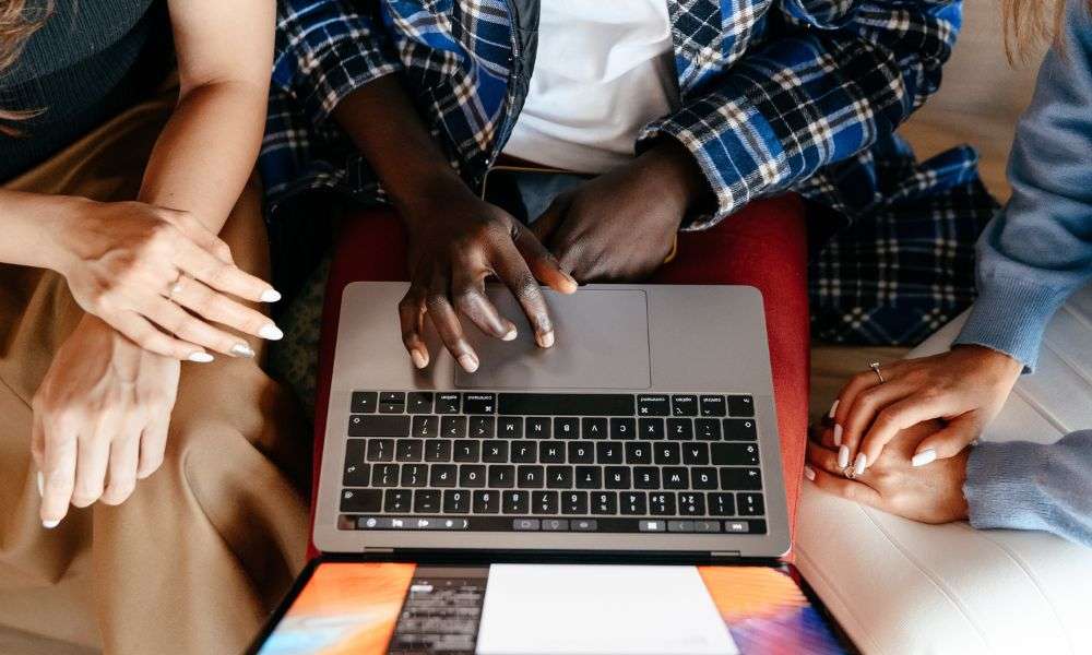 people around laptop