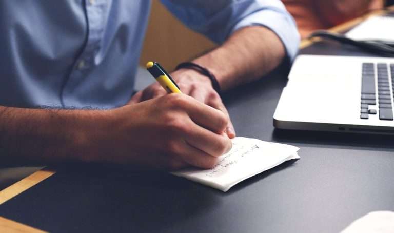 writing notes at desk