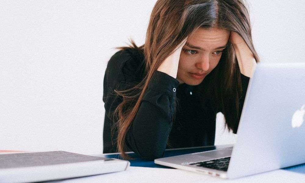 stressed woman at laptop