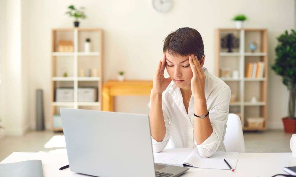 stressed woman at laptop
